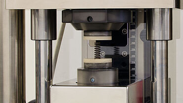 Spring testing machine – detailed image of compression fixture